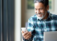 Older man looking at cell phone