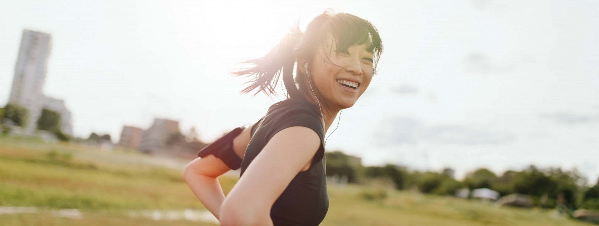 Young Asian Woman Smiling Outside